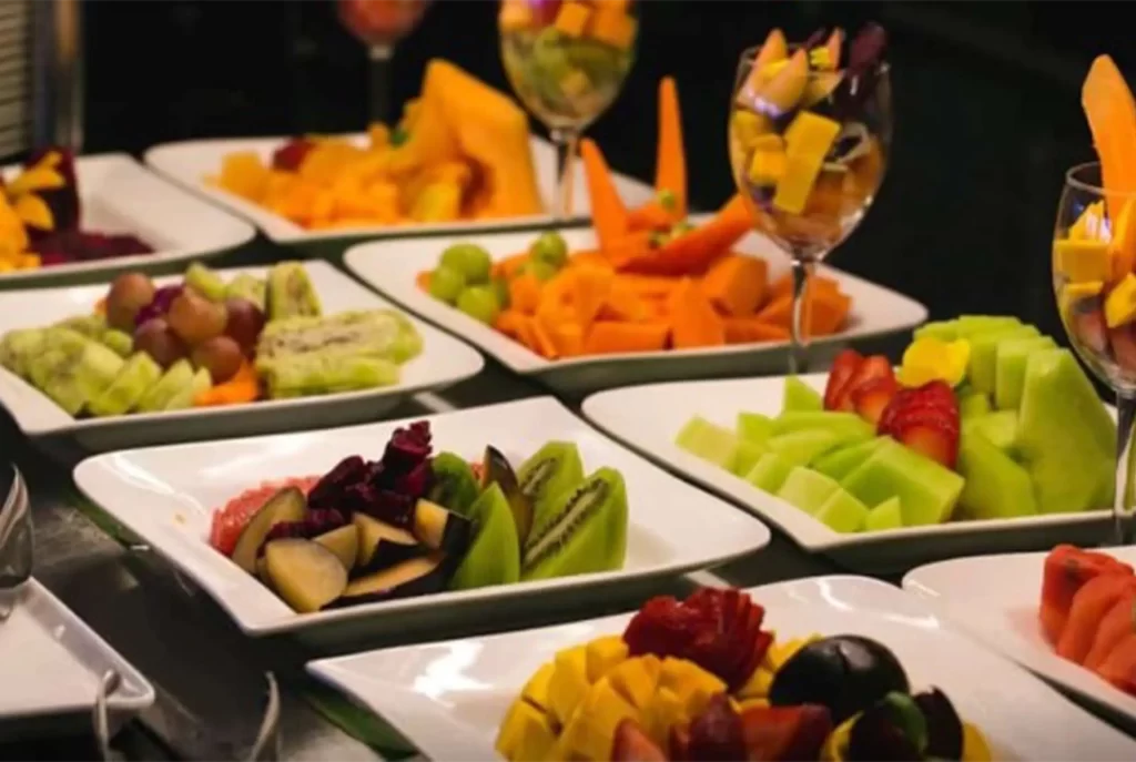 Tropical fruit buffet at Hotel Regatta Cartagena breakfast with kiwi, mango, melon and strawberries.
