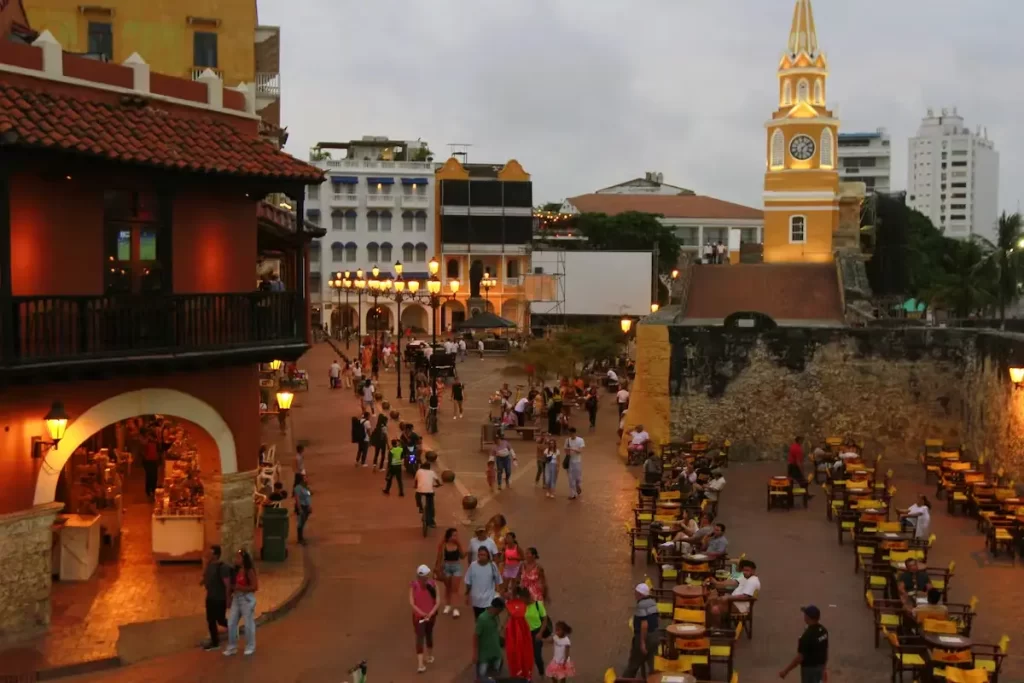 Clock Tower at sunset with tourists in Cartagena's walled city

