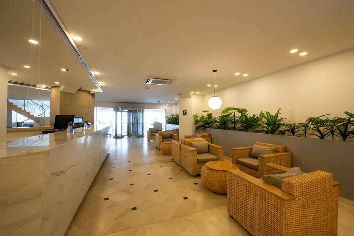 Modern hotel reception and lobby lounge in Cartagena to help decide whether to book direct or through a platform.